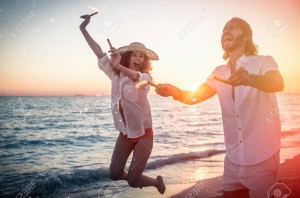 Young couple sharing happy and love mood on the beach